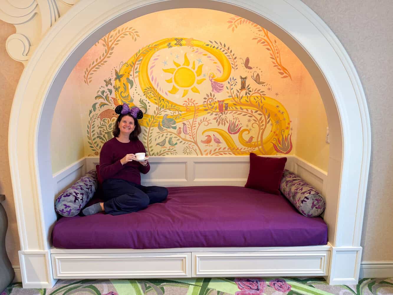 Erin enjoying tea in the alcove of the Fantasy Springs Hotel room. 