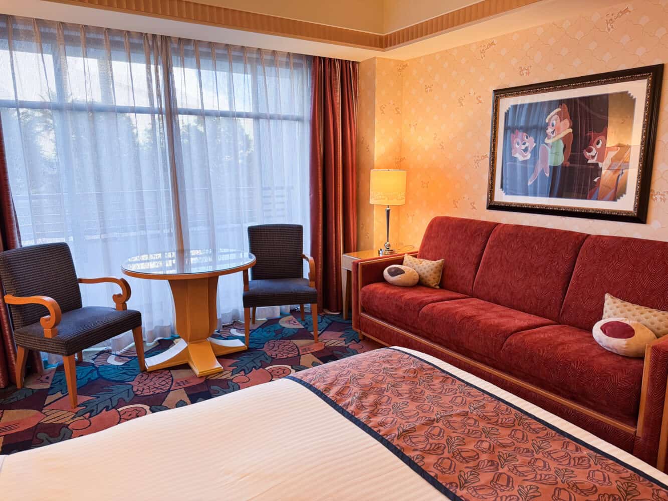 Couch and table and chairs in the Chip and Dale twin room at Ambassador Hotel Tokyo Disney.