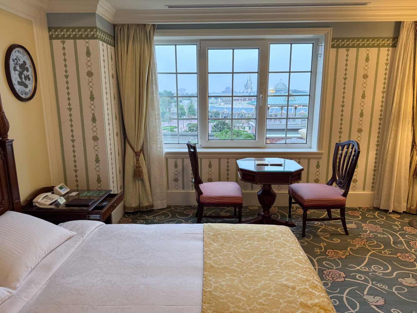 Tables by the window in the Standard Superior Room at Tokyo Disneyland Hotel. 